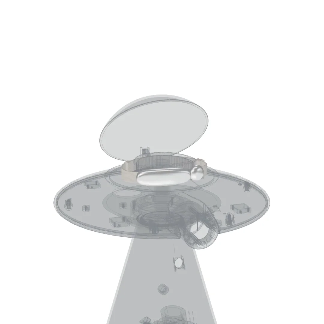 Transparent cutaway of the Catellect Home Hub with the Collar stored beneath its open lid